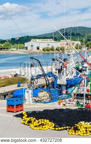 Santona, Spain - July 4, 2021: View Of Colorful Fishing Boats In The Port Of Santona, Cantabria, Nor