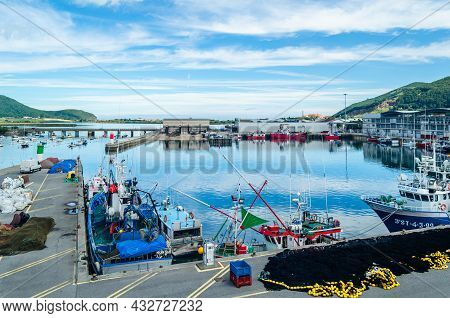 Santona, Spain - July 4, 2021: View Of Colorful Fishing Boats In The Port Of Santona, Cantabria, Nor