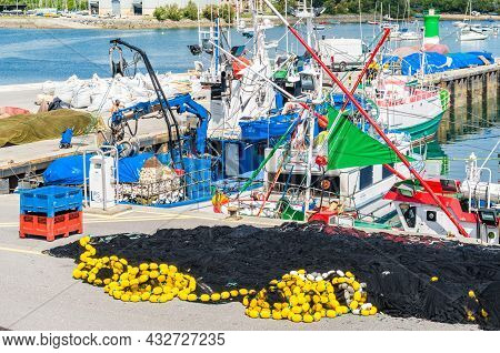 Santona, Spain - July 4, 2021: View Of Colorful Fishing Boats In The Port Of Santona, Cantabria, Nor