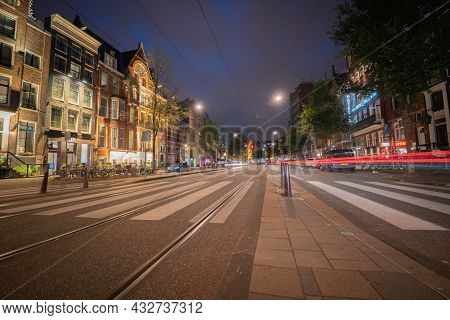 Amsterdam-netherlands - August 21 2017; Night Time In The City, Lights, Street Markings And Red Ligh