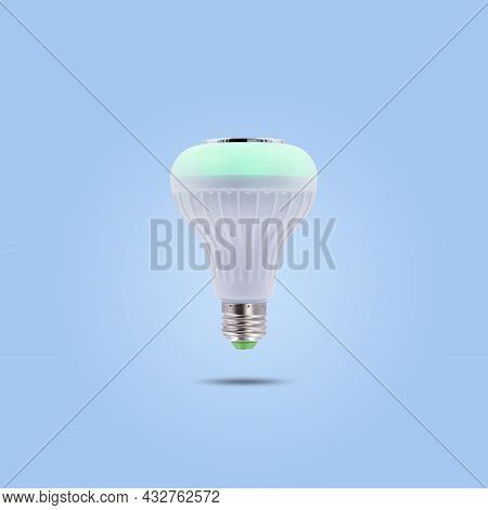 Green Color Led Energy Saving Lamp 230v Isolated On Blue Pastel Color Background.