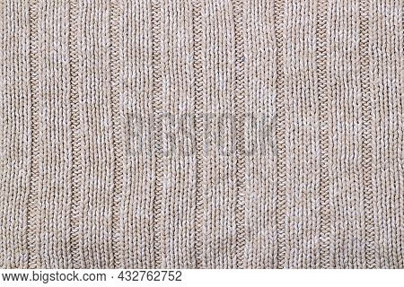 Beige Texture Of Knitted Wool Sweater. Hand Knitting. Knit And Purl Stitch Pattern.