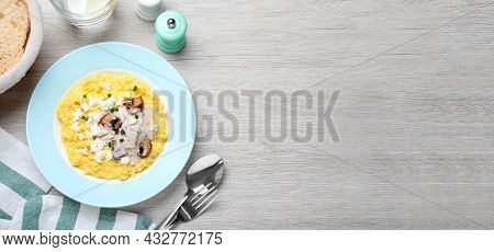 Traditional Ukrainian Banosh Served With Brynza And Mushrooms On Light Wooden Table, Flat Lay. Space