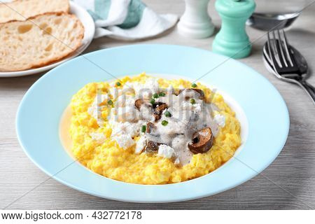 Tasty Banosh Served With Brynza And Mushrooms On Light Wooden Table, Closeup. Traditional Ukrainian 