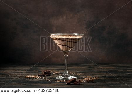 Chocolate Truffle Martini Cocktail On Dark Wooden Background, Copy Space. Mudslide Truffletini Cockt