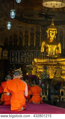 Bangkok, Thailand - Nov 15, 2020 : Buddhist Monks Sitting Praying And Pay Respect Buddha Image In Ma