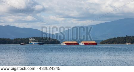 Salt Spring Island, British Columbia, Canada - August 23, 2021: Industrial Tugboat Pulling Seaspan C