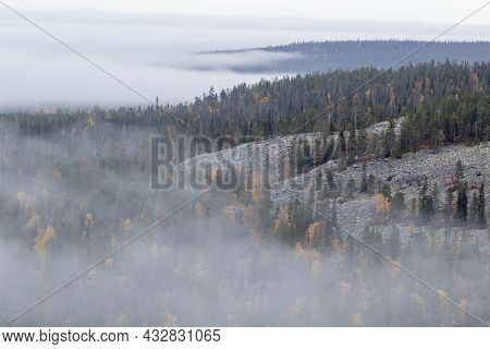 Foggy View Of Forests Of Sallatunturi On A Foggy Autumn Morning During Autumn Foliage In Northern Fi