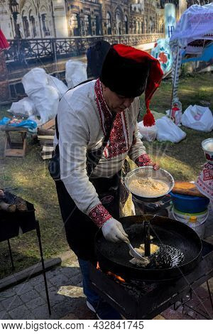 Korosten' Ukraine - September 04 2021: Festival Of Potato Pancakes In The City Park. A Colorful Man 