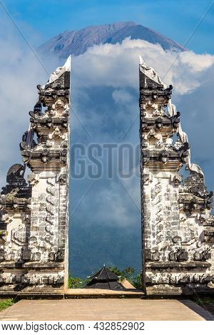Ancient Gate At Pura Penataran Agung Lempuyang Temple And Volcano Agung On Bali, Indonesia In A Sunn