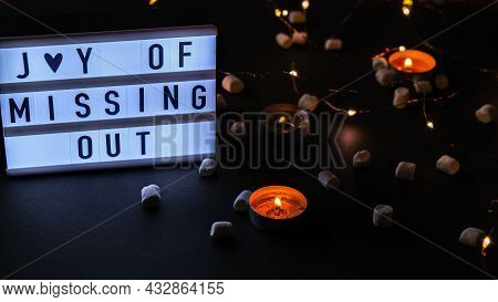 Lightbox With Text Jomo Joy Of Missing Out. The Concept Of Relaxation From Information And Gadgets. 