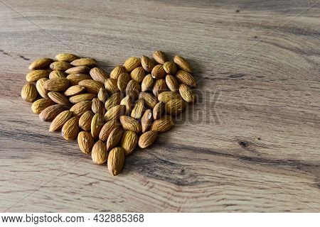 Almonds Lying On The Table In The Form Of A Heart. Copy Space