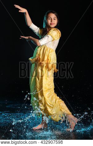 Bright Slender Beautiful And Cheerful Dark-haired Teenage Girl 12 Years Old In A Yellow Silk Dress B
