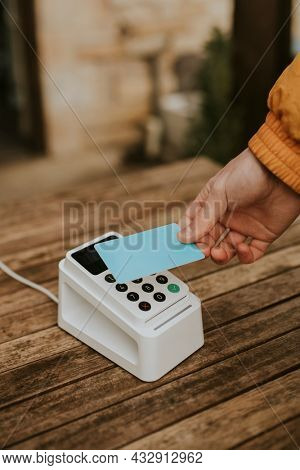 Cashless payment in the new normal with hand scanning credit card on card reader machine