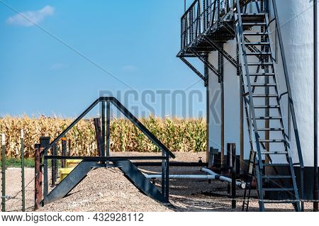 Ramp And Stairs Over A Secondary Containment Dike For Chemical Oil Storage Confined Space