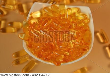 Fish Oil Gelantine Capsules In A White Bowl On A Beige Background .omega Fatty Acids Gelantine Capsu
