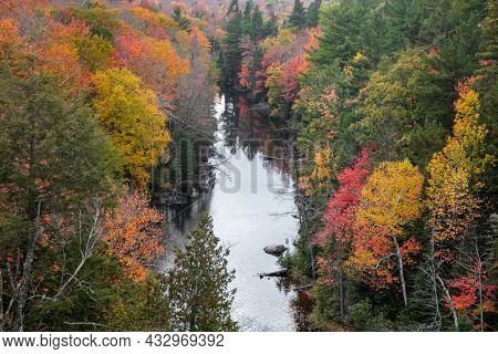 Aerial view of colorful fall foliage along Dead river in Michigan upper peninsula