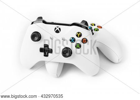 Moscow, Russia - April 18, 2019: Wireless gamepads for Xbox console - isolated on white background.