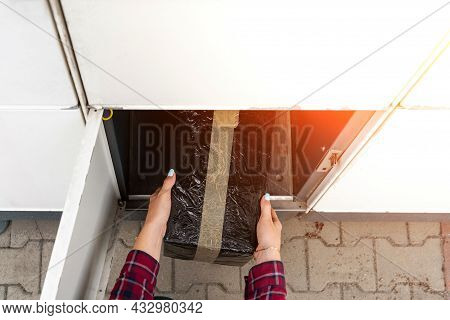 Automated Locker. Parcel Courier Box In Woman Hands At Post Delivery Automat Terminal. Courier Puts 