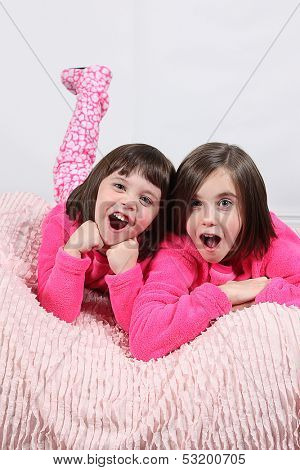 Adorable little girls posing for photos in PJ's
