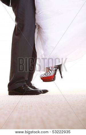 Wedding Couple. Legs Of The Groom And The Bride.