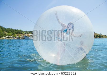 Joyful Girl In A Balloon Floating On Water.