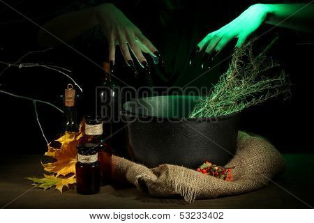  Witch in scary Halloween laboratory on dark color background