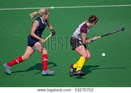BLOEMFONTEIN, SOUTH AFRICA - AUGUST 7: Unidentified players during a womenâs field hockey match between the North West and Free State Universities, on Aug 7., 2010 in Bloemfontein, South Africa.