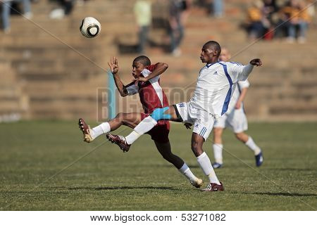 BLOEMFONTEIN, SOUTH AFRICA - AUGUST 7: Unidentified players during a men's soccer match between the North West and Free State Universities, on Aug 7, 2010 in Bloemfontein, South Africa.