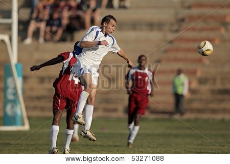 BLOEMFONTEIN, SOUTH AFRICA - AUGUST 7: Unidentified players during a men's soccer match between the North West and Free State Universities, on Aug 7, 2010 in Bloemfontein, South Africa.