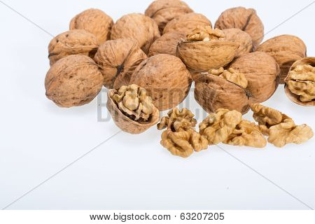 walnut and a cracked walnut isolated on the white background