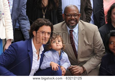 LOS ANGELES - APR 02:  Orlando Bloom, Flynn Bloom & Forest Whitaker arrives to the Walk of Fame honors Orlando Bloom  on April 02, 2014 in Hollywood, CA                