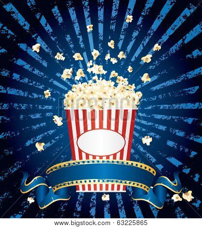 vector illustration of the popcorn explosion on blue grunge burst with blank cinema banner