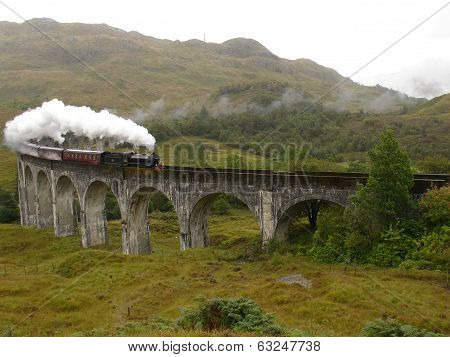 Steam train on Glenfinnan viaduct.