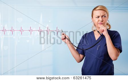 Pretty young medical doktor listening to red pulse and heart rates