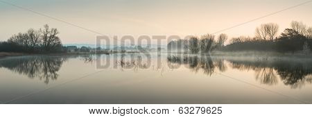 Stuning Tranquil Landscape Panorama Of Lake In Mist