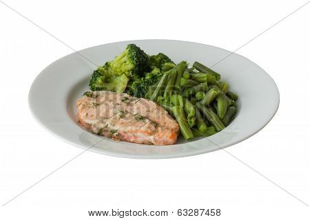 Roast Fish With Green Vegetables On A White Plate Isolated