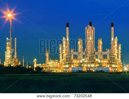 Lighting Of Oil Refinery Palnt Against Dusky Blue Sky Of Oil Refinery Plant In Heavy Petrochemical I