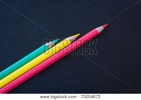 Different Color Pencils Sharpened On Dark Background