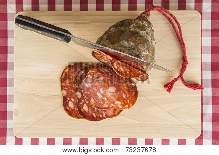 Knife Slicing A Spanish Sausage Called Morcon