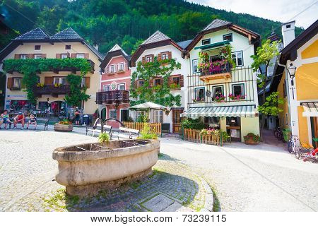 Public Drinking Water Fountain With Typical Colorful Houses In Hallstatt