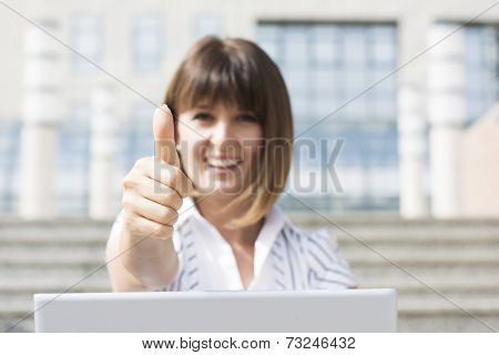 Thumbs Up From Business Woman