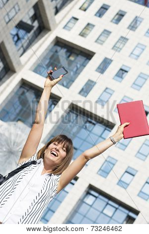 Happy Businesswoman With Both Hands Up