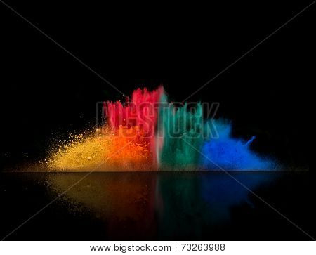 Freeze motion of colored dust explosion isolated on black background