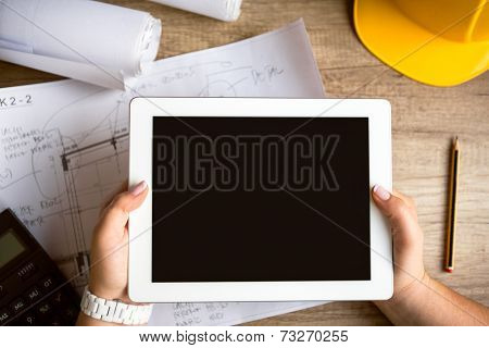 tablet architecture equipment with work tool on wooden desk 