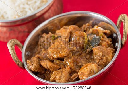 Chicken malabar curry in a traditional kadai or karahi bowl