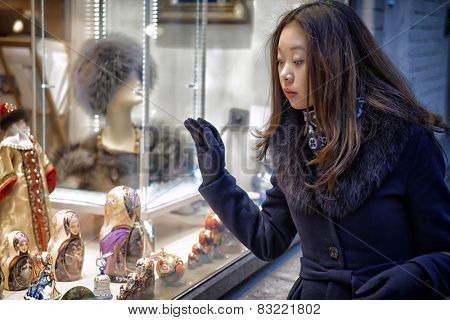 Real Photo Asian girl near funiture shop