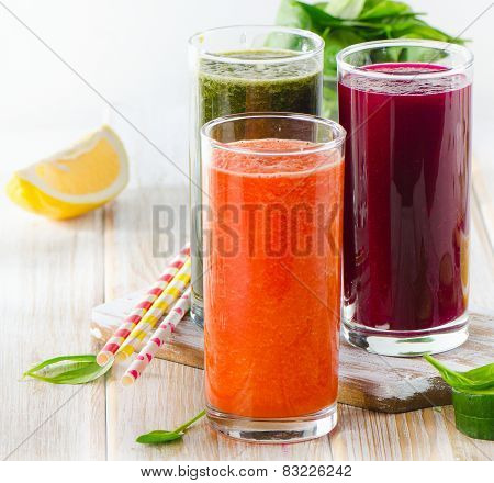Fresh Vegetable Juices On A Wooden Background