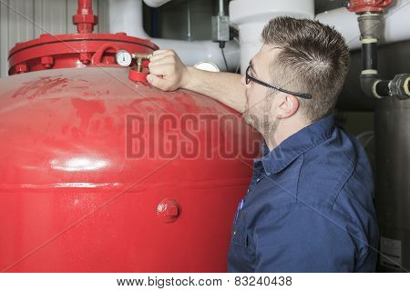 A good serviceman working on a machine room