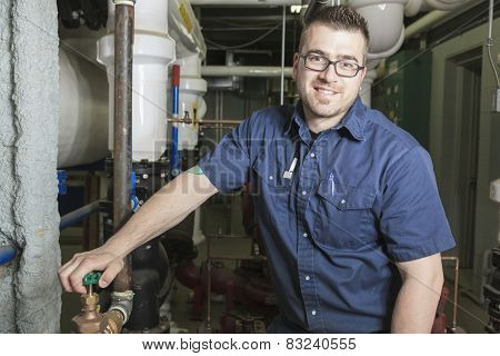 A good serviceman working on a machine room